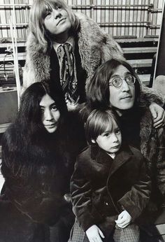 an old black and white photo of three women, one with a child on her lap