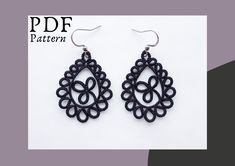 the earrings are made out of black thread and have an intricate design on each side