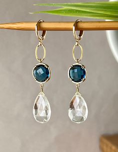 Elegant Earrings with Faceted Clear Crystal Pear Drops 17 x 12 mm Faceted Blue Sapphire Glass Stones in Gold Plated Bezel setting 12 x 12 mm Gold plated Lever back Round Ear clasp. The total length is 2.3 inches or 58 mm * *.* * * * * * * * * * * * * * * * * * * * * * * * * * * * Your order will be wrapped and shipped in jewelry gift box. Please enter my shop here - www.etsy.com/shop/ZarinaJewelry or my FB page - facebook.com/ZarinaJewelry Faceted Drop Earrings For Wedding, White Faceted Earrings For Wedding, Briolette Faceted Wedding Earrings, Wedding Briolette Faceted Earrings, Wedding White Faceted Earrings, Teardrop Faceted Earrings For Wedding, Faceted Teardrop Earrings For Weddings, Blue Briolette Earrings For Wedding, Wedding Teardrop Faceted Earrings