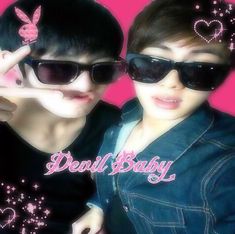 two people wearing sunglasses and pointing fingers at the camera with hearts on their foreheads