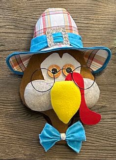 a turkey wearing a hat and glasses with a bow tie