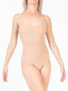 A must-have in any performer's closet. This body liner features customizable clear straps with multiple points of attachment, so you can get the perfect fit and silhouette every time. This simple single layered microfiber leo, is awesome under dresses, or any other leotard that might have come without a lining. Features -full coverage single layer leotard -clear adjustable and customizable shoulder straps -multiple back strap attachment points -mesh crotch lining. Additional Info Body Wrappers® Dance Belt, Womens Leotards, Leotard Tops, Short One Piece, Custom Strap, Girls Leotards, Belted Pants, Dance Leotards, Team Wear