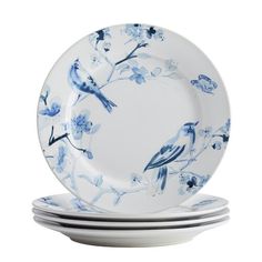 blue and white plates stacked on top of each other in front of a white background