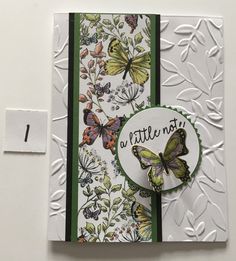 a close up of a greeting card with butterflies on the front and back of it