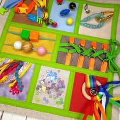 a close up of many different items on a table near scissors and other crafting supplies