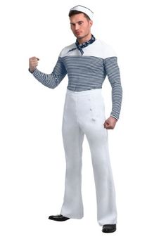 a man in white pants and striped shirt is posing for the camera with his fist up