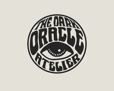 the dark oracle atelierr logo with an evil eye in it's center