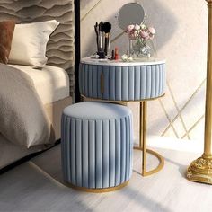 an advertisement for a furniture store with a blue stool and mirror on the side table