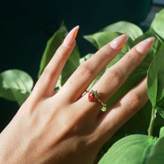 Strawberry Ring Adjustable Gold Ring Cute Jewelry Adorable Strawberry Ring Gift for Her Cottagecore Jewelry Fairy Ring Fairy Jewelry Gold __LISTING DESCRIPTION ☽ 18k Gold Plated Adjustable Ring, Enamel ☽ This ring is gold plated and may require extra care. PLEASE follow these tips to make the ring last longer in its original condition: avoid wearing it to the beach, pool, shower, bathtub, hot tub; avoid it touching any lotions, creams, or sweat; take it off before going to bed ☽ Packaged with a Cute Tiny Rings For Gifts, Cute Small Ring As Gift, Cute Handmade Flower Ring For Gift, Whimsical Adjustable Rings, Handmade Cute Promise Ring, Cute Handmade Promise Ring, Cute Red Ring For Gift, Cute Red Ring As Gift, Cute Flower Ring Gift