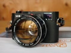 an old camera sitting on top of a table