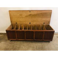 an old wooden trunk with six compartments