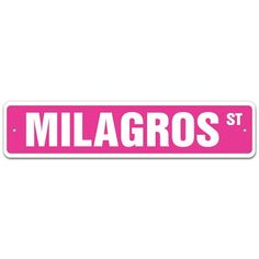 a pink street sign with the word milagros st on it's side