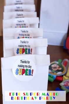 there are many thank tags on the table for someone to put in their birthday bags