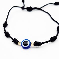 Throughout the whole human history, in every culture and religion, the eye figure has been considered as a powerful talisman to defy evil forces. One of the most popular amulets is the blue glass eye charm. The evil eye is a curse or legend believed to be cast by a malevolent glare usually catching a person unaware. You can wear an evil eye bracelet or lucky eye necklace to save yourself from negative energies, such as anger, hatred, fear, jealousy and other such evil energies that can affect yo Adjustable Black Bohemian Evil Eye Bracelet, Black String Bracelet, Adjustable Blue Evil Eye Bracelet Hand-strung, Adjustable Hand-strung Black Evil Eye Bracelet, Affordable Adjustable Hand-strung Evil Eye Bracelet, Adjustable Red Evil Eye Bracelet, Hand-strung, Eye Rings, Evil Eyes, Evil Eye Ring