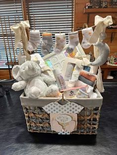 a basket filled with baby items on top of a table