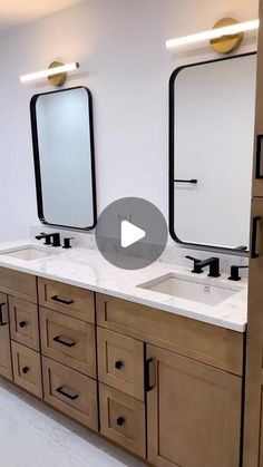 a large bathroom with double sinks and mirrors