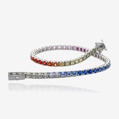 Multicolor Natural Sapphire Tennis Line Bracelet 14K White Gold | 3 1/2 Carats Indulge in the vibrant hues of this stunning multicolor natural sapphire tennis line bracelet. Crafted in 14 karat white gold, this classic and sturdy bracelet features over 3 1/2 carats of natural sapphires in a range of enchanting colors. From green to blue, pink, orange, red, yellow, and purple, each sapphire showcases its unique brilliance and adds a touch of elegance to your wrist. Specifications:- Material: 14 k Multicolor Gemstone Tennis Bracelet, Multicolor Multi-stone Round Tennis Bracelet, Multicolor Multi-stone Round Diamond Bracelet, Multicolor Multi-stone Diamond Bracelet, Multicolor Fine Jewelry Tennis Bracelet With Jubilee Style, Fine Jewelry Multicolor Tennis Bracelet With Jubilee Style, Green To Blue, Bracelet Clasps, Natural Sapphire