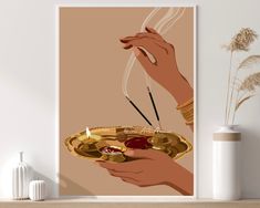 two hands holding a plate with food and chopsticks on it next to a vase