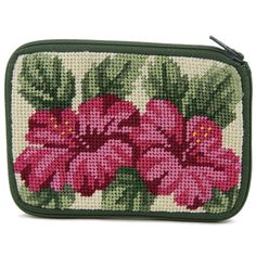 a cross stitch purse with pink flowers on the front and green leaves in the back