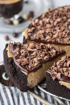 there is a chocolate cake on the plate with one slice cut out and ready to be eaten