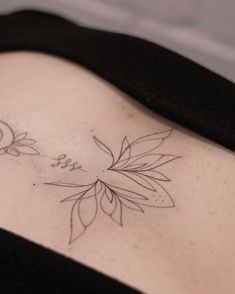 a woman with a tattoo on her stomach