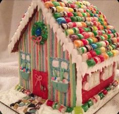 a gingerbread house decorated with candy and candies