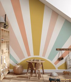 a child's room painted in pastel colors with sunbursts on the wall