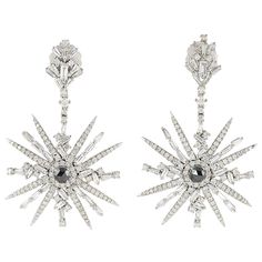 Handcrafted from 18-karat white gold, these starburst earrings are set with 5.41 carats of glimmering diamonds. FOLLOW MEGHNA JEWELS storefront to view the latest collection & exclusive pieces. Meghna Jewels is proudly rated as a Top Seller on 1stDibs with 5 star customer reviews. All items manufactured by us are handmade and can be customized or redesigned. Composition Size-52X32 MM Total Weight-15.922 Gold Weight(Gms)-14.84 Diamond Wt(Cts)-5.41 Art Deco Drop Earrings, Gold Diamond Drop Earrings, White Gold Drop Earrings, Kelly Rutherford, Cocktail Earrings, Starburst Earrings, Chalcedony Earrings, White Gold Earrings, Diamond Drops