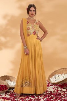 Yellow anarkali with floral embroidered bodice using cutdana, dori, sequins, beads, tassels work. Comes along with a dupatta. - Aza Fashions Yellow Georgette Floor-length Churidar, Eid Anarkali Sleeveless Gown, Traditional Sleeveless Gown For Navratri, Sleeveless Resham Embroidery Gown For Eid, Sleeveless Anarkali Gown For Eid, Traditional Sleeveless Gown For Diwali, Anarkali Sleeveless Salwar Kameez With Dori Work, Sleeveless Anarkali Salwar Kameez With Dori Work, Sleeveless Georgette Salwar Kameez For Festivals