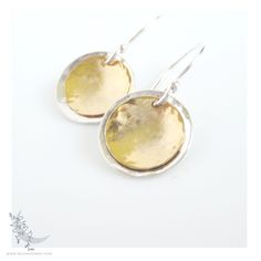 "Lunar Eclipse * Petite Handmade Sterling Silver & 14k Gold fill Hammered Mixed Metal Disc Earrings * These Sterling Silver & 14k Gold fill coins were hand hammered, formed and shaped in gentle concave discs. The metal discs were then brushed & polished for shine and suspended from handmade Sterling Silver earwires. These petite & lightweight earrings are a wonderful little everyday earring with a minimalist and extremely versatile design. MEASUREMENTS: - Earrings total length: petite - 1\" (2.5 cm) - Sterling Silver discs: 15mm - 14K Gold Fill discs: 12mm Jewelry will arrive in a decorative organza bag. ONE-OF-A-KIND: All of the jewelry at Wild Moon Art & Jewelry is meticulously & individually hand crafted by me. As such, each piece of jewelry will be wonderfully unique. The color graduat Gold Sterling Silver Round Disc Earrings, Cadmium-free Brass Earrings For Anniversary, Eclipse Jewelry, Solar Lunar, Silver Gold Earrings, Earrings Circle, Wild Moon, Mixed Metal Earrings, Mixed Metal Jewelry