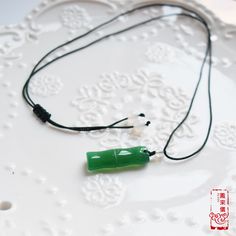 Decorated with natural jade stone charms, this collection of necklaces expresses Chinese typical themes under the background of jade culture. We select a series of carved jade stone pendants: lotus, baby lock, bamboo, and peace buckle. Jade is a symbol of the virtue of gentlemen and highly prized for its strength and beauty. It will bring people good fortune and soft elegance. The paired necklace is adjustable with braided craft, made of top-quality jade cords. The overall design embodies implic Chinese Jade Necklace, Jade Pendant Necklace, Chinese Jade, Carved Jade, Baby Lock, White Agate, Jade Necklace, Jade Carving, Green Agate