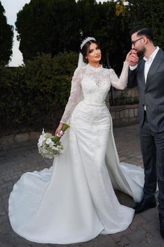 a bride and groom posing for a photo