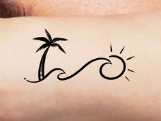 a woman's arm with a palm tree and wave tattoo on it, which is drawn in black ink