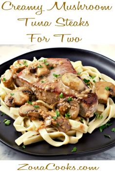 a black plate topped with pasta covered in mushrooms