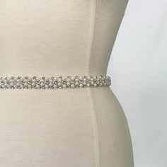 A pearl-embellished belt that sits at the waistline of your bridal gown or skirt and adds a little something special to your bridal look with three rows of glittering crystals to catch the light. Perfect to wear with a plain dress that you wish to accessorize. Fastens with a concealed closure at the back. Our belts are made-to-order, so please send us your waist measurement in inches when purchasing and we will make it to your correct size. Embellish your wedding look with any of our Oscar Lili Silver Wedding Dress, Pearl Belt, Embellished Belt, Wedding Dress Belt, Bridal Fabric, Plain Dress, Dress Belt, Waist Measurement, Wedding Looks