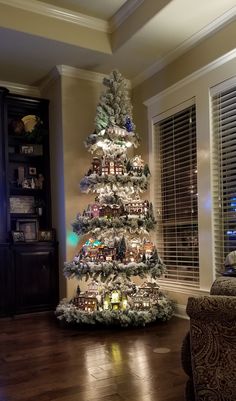 a decorated christmas tree in a living room