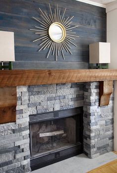 a fireplace with a mirror above it and a fire place on the wall next to it