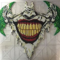 a close up of a piece of art made to look like a joker's teeth