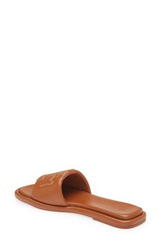 A sleek leather slide accented by Tory's signature double-T logo is ready to upgrade your warm-weather style. Leather upper and lining/rubber sole Imported Women's Shoes Leather Slides, Slide Sandals, Warm Weather, Tory Burch, Sleek, Womens Sandals, Leather Upper, Nordstrom, Sandals