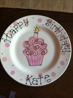 a birthday plate with a cupcake on it