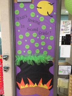 a classroom door decorated with an image of a witch's pot and the words what's growing in second grade?