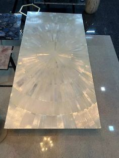 a table that has some kind of glass on it in the middle of a room