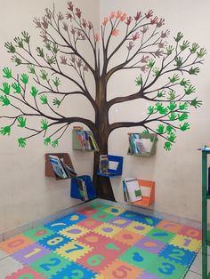 a large tree painted on the wall in a children's playroom with colorful rugs