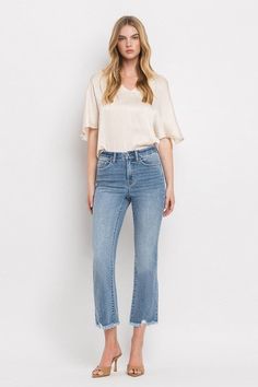 VERVET High Rise Merciful Crop Flare Jeans These medium wash jeans feature comfort stretch denim with a high rise, cropped flare silhouette, with minimal distressing, and raw frayed hem. Our go-to style, these are perfect for your casual occasions or for dressing up with a blouse. An easy to wear style you'll be reaching for! Medium wash High Rise Cropped flare cut Raw frayed hem Fit: True to size. Fabric Content: 93% Cotton / 5% Polyester / 2% Spandex Model is 5'10" wearing size 26 Rise: 10" In Nine Line Apparel, Crop Flare Jeans, Crop Flare, Curvy Shorts, Curvy Swimwear, Cropped Flare Jeans, Swimwear Dress, Sweatshirt Set, Denim Collection