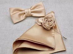 "This listing is for 1 beautiful pretied bow tie with matching pocket square and gorgeous rose lapel pin. Our experienced team has over 100 years worth of professional sewing experience combined. Our items are produced to the highest standards and quality is assured! **The bow tie is pre tied and hand stitched into place.** Material: Satin ATTACHMENT/STRAP: - CLIP-ON (strapless) - Adjustable VELCRO strap - Adjustable strap with METAL HOOK, EYE ADJUSTER HARDWARE SIZES are shown below: - NEWBORN-1 Elegant Bow Tie With Pocket Square As Gift, Bowtie Groomsmen, Champagne Bow Tie, Pocket Square Rules, Pocket Square Guide, Suits Groom, Pocket Square Styles, Pocket Square Pattern, Mens Bowtie