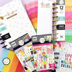 the contents of a planner spread out on top of each other, including notebooks and papers