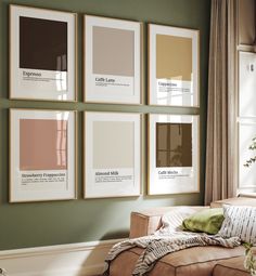 a living room filled with furniture and framed pictures on the wall above it's windows