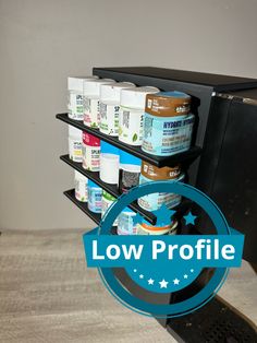 the low profile shelf is holding several products and has a blue label reading low profile