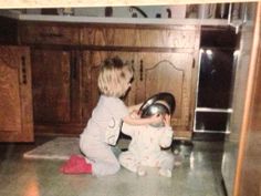 two young children are playing with each other