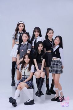 the girls are posing together in school uniforms